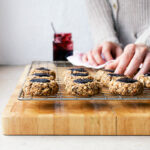 Jam thumbprint cookies on a wire rack.
