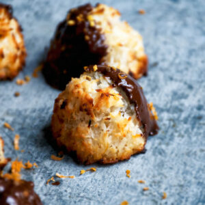 Close up of macaroons on a metal tray.