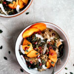 Two bowls of porridge with persimmon, seeds, and nut butter.