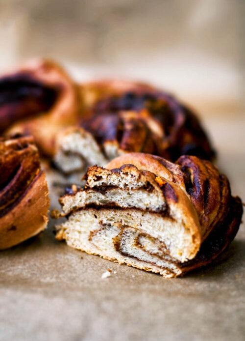 A slice of chocolate orange babka removed slightly from the loaf.