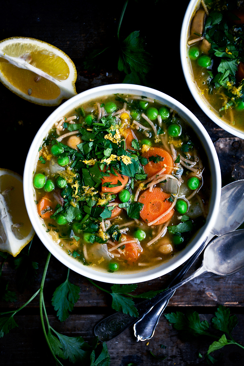 Soup with carrots, noodles, and greens.