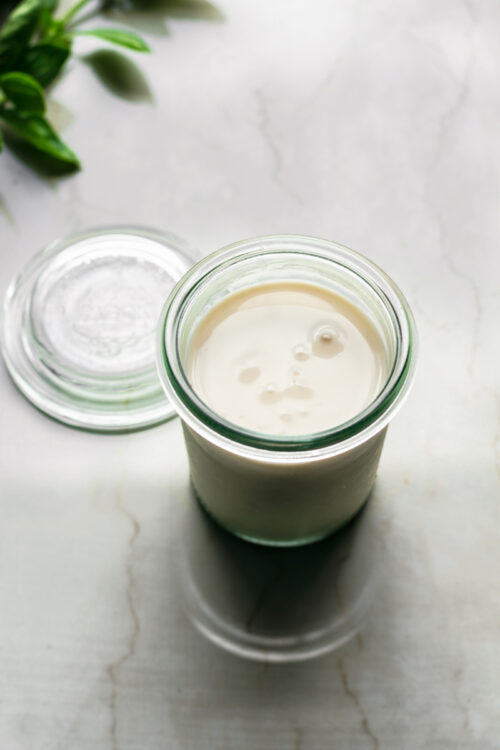 Oat cream in small glass jar.