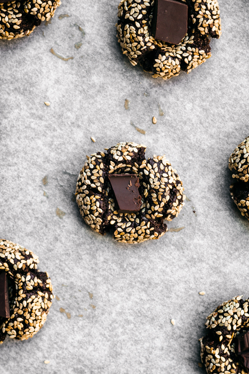 Chocolate thumbprint cookies with sesame seeds and chocolate centre.