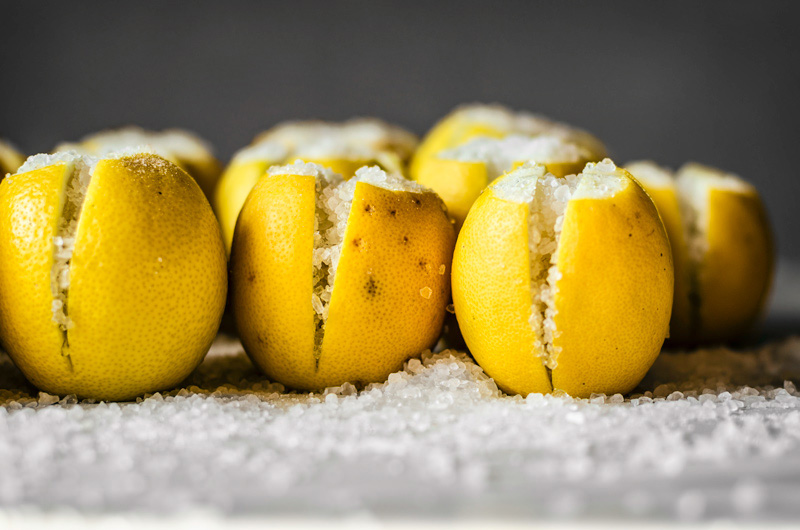 Preserved lemons stuffed with coarse salt.