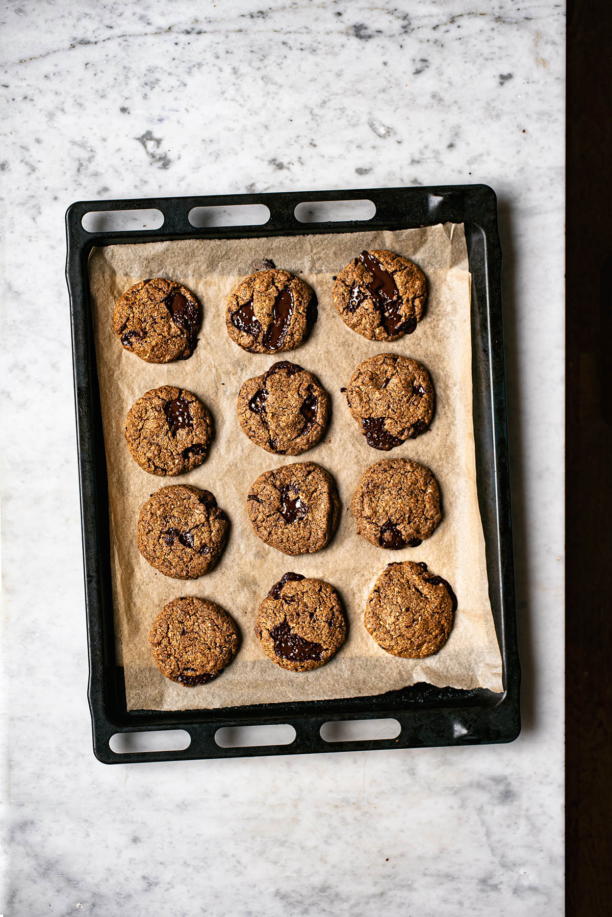 A baking sheet of chocolate chunk cookies.