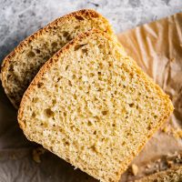 Slices of bread, top down view, on parchment paper.