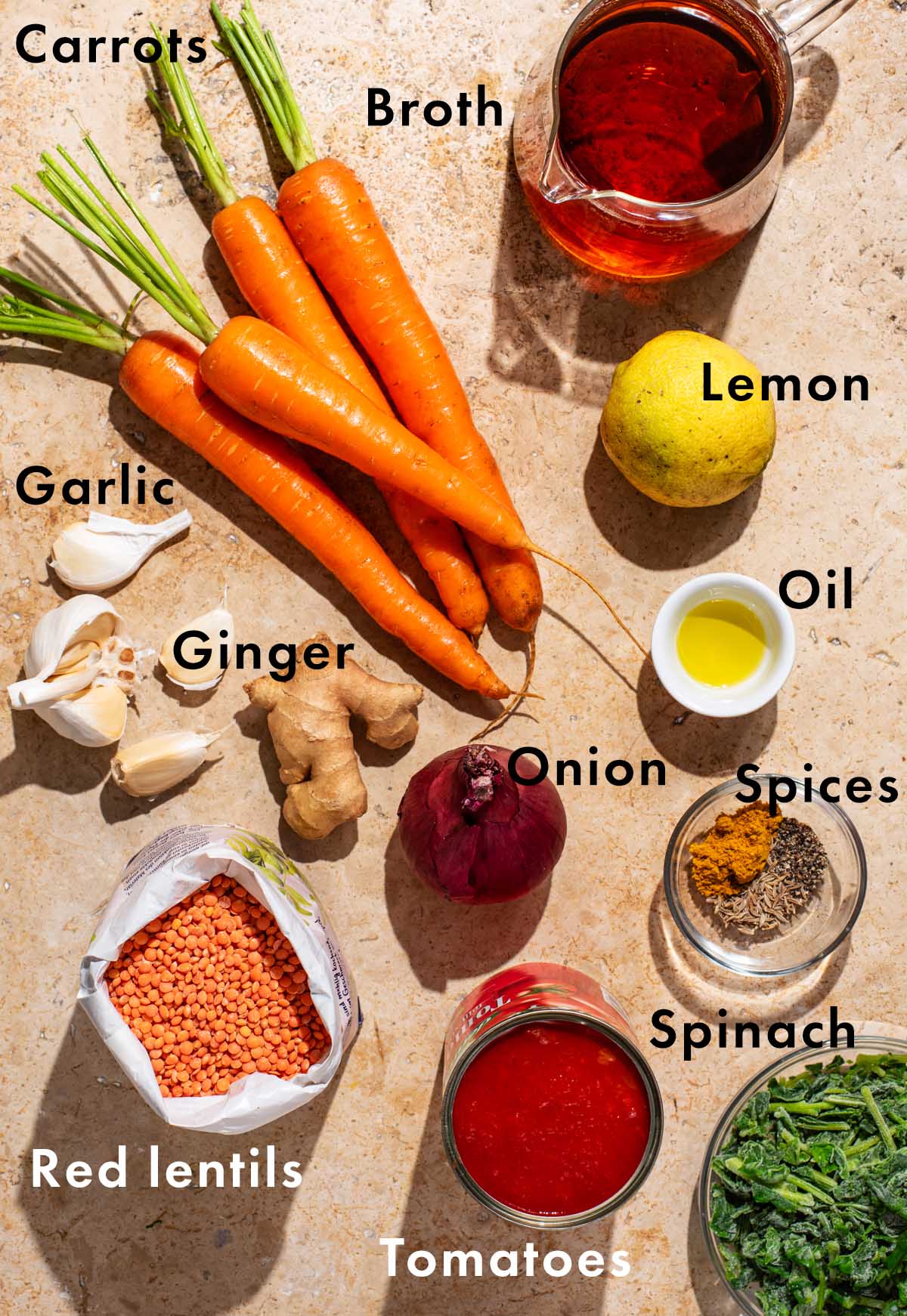 Carrot red lentil soup ingredients with labels.