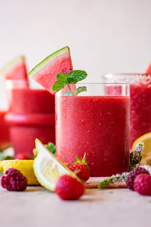 Close up of a pink smoothie in a glass.