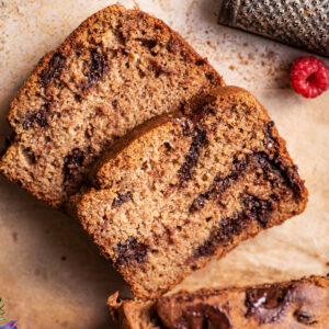 Top down view of two slices of banana bread cut from a loaf.