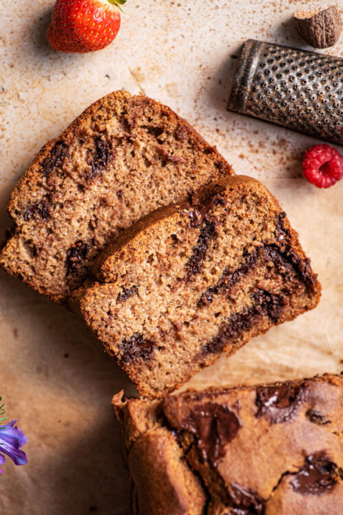 Top down view of two slices of banana bread cut from a loaf.