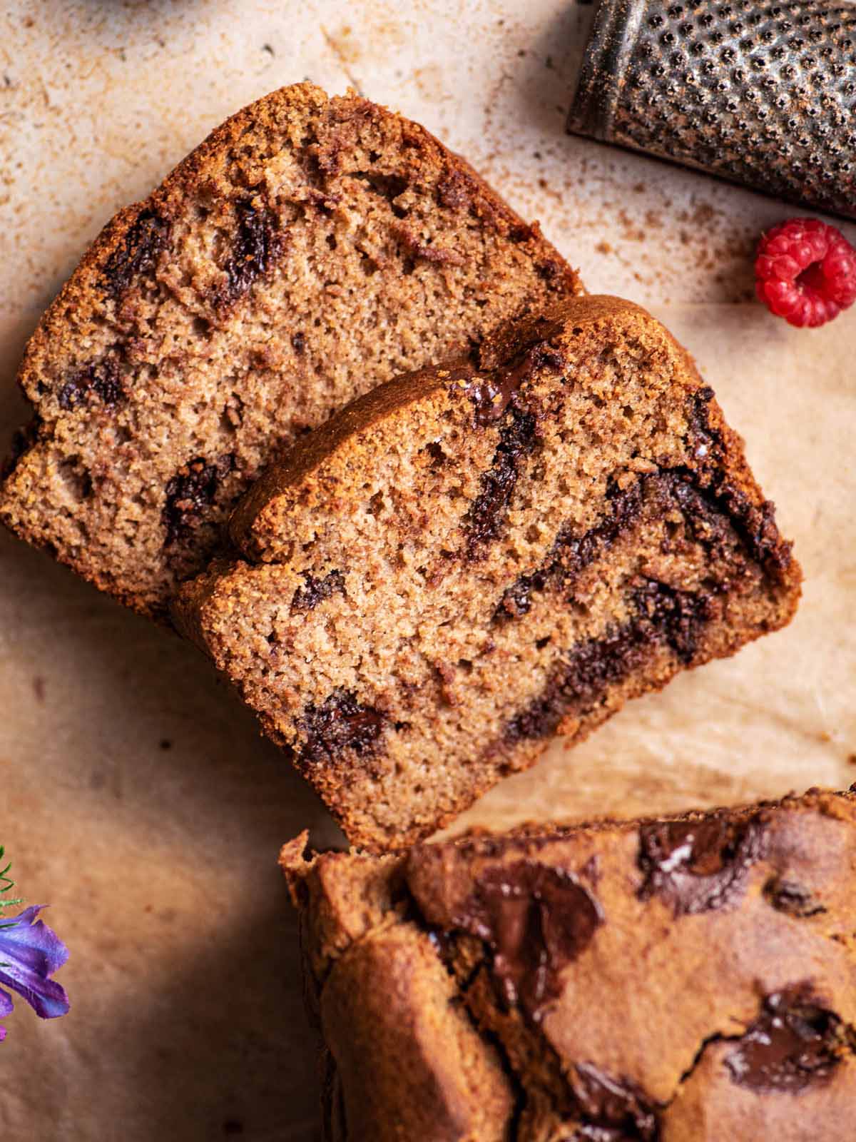 Top down view of two slices of banana bread cut from a loaf.