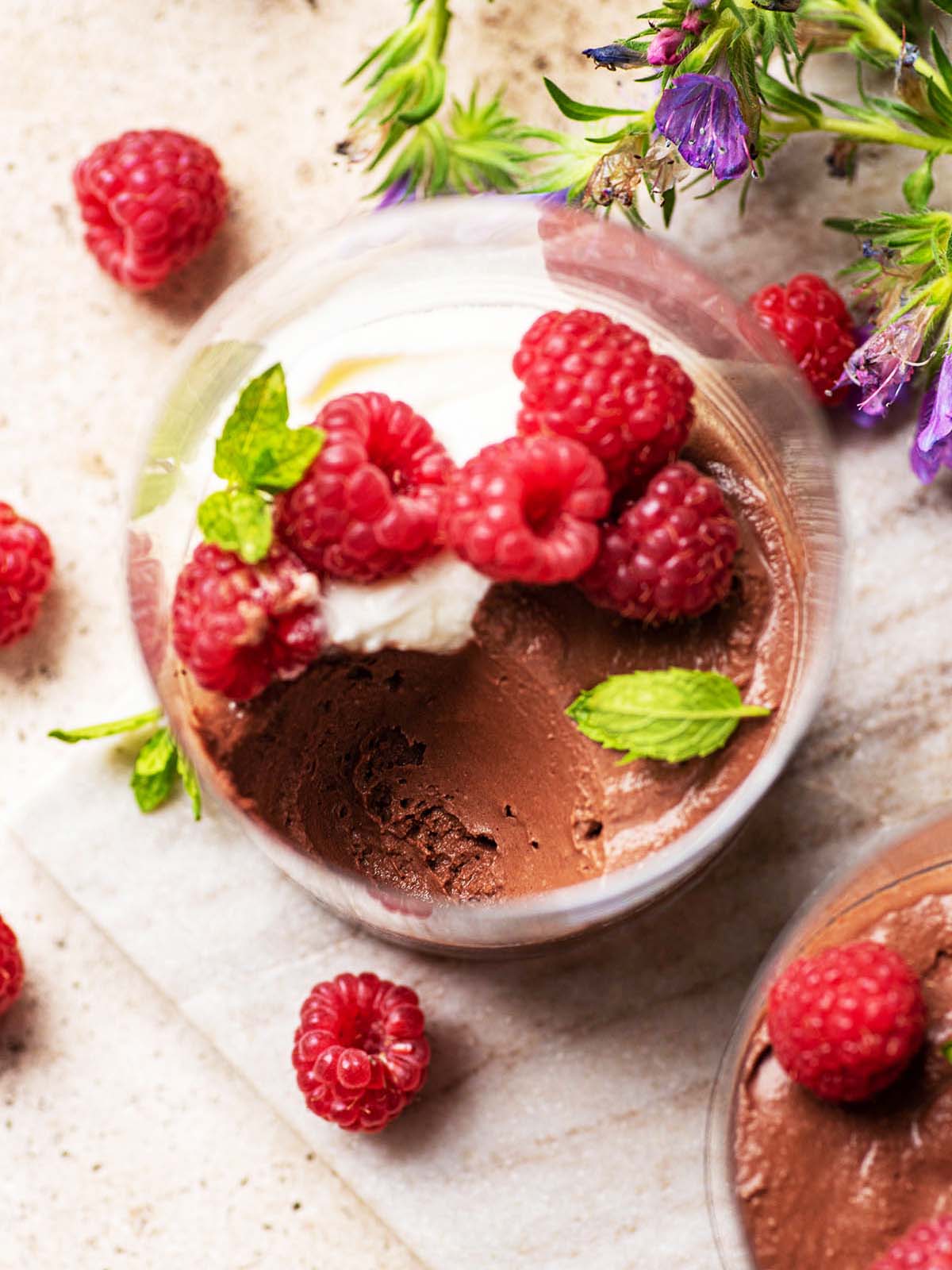 Top down view of chocolate mousse with a spoonful removed.