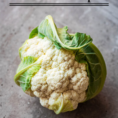 A cauliflower head on a stone background with text stating the post title.