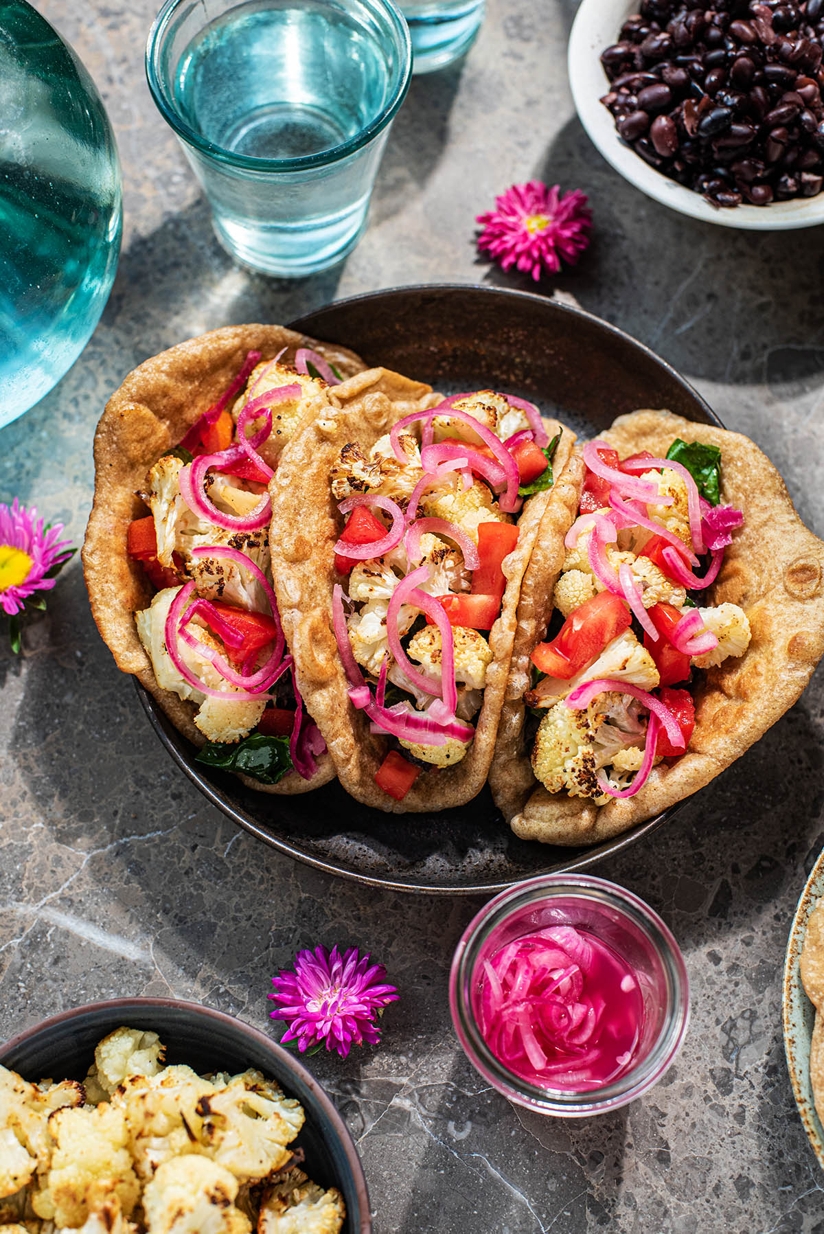 Cauliflower tacos with pickled onions.