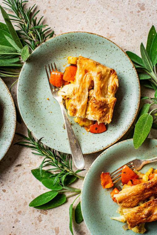 Plates with pieces of puff pastry pie on them.