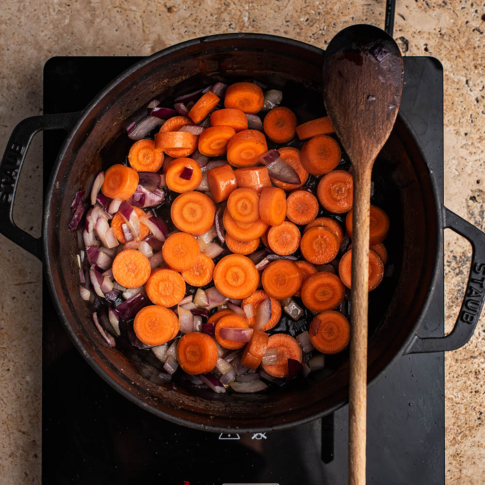 Carrots and onions in the pot.