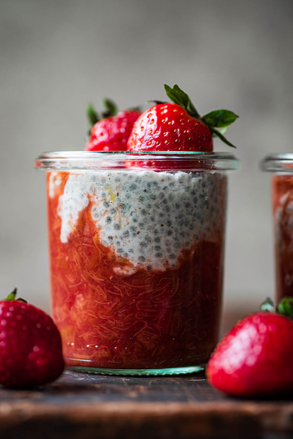Close up of a jar with rhubarb compote and chia pudding.