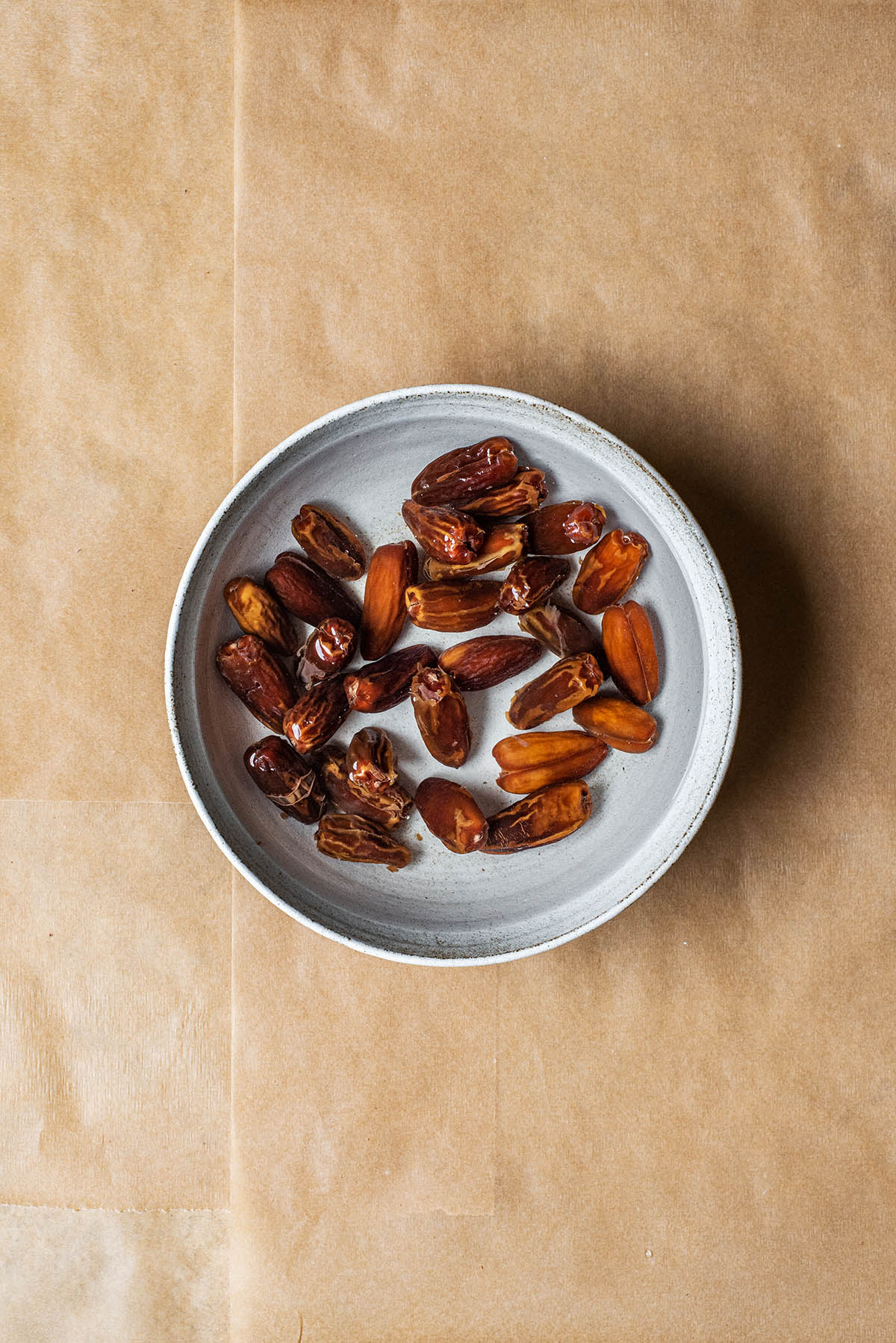 Dates soaking in a bowl of water.