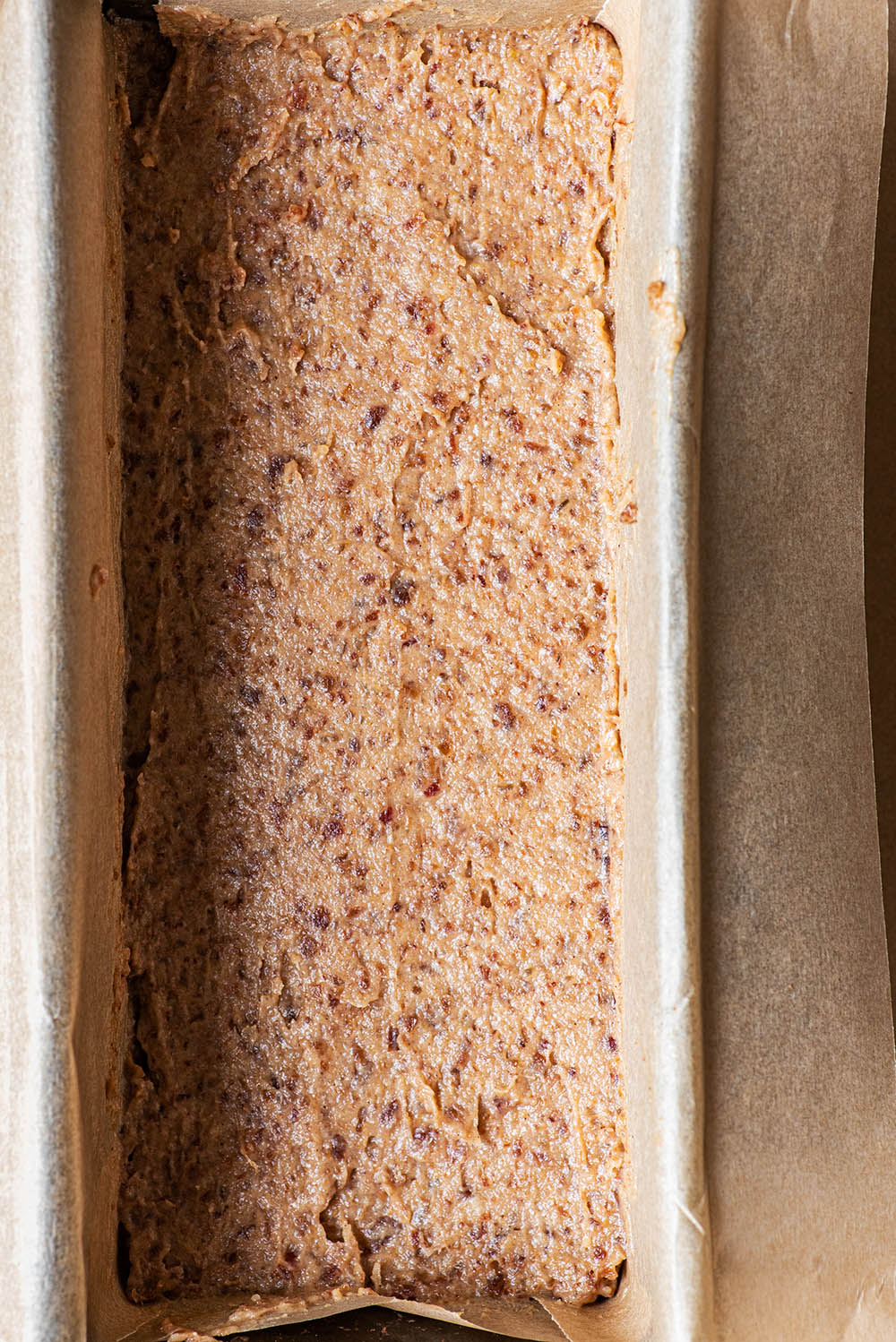 Date caramel spread into an even layer over the shortbread base.