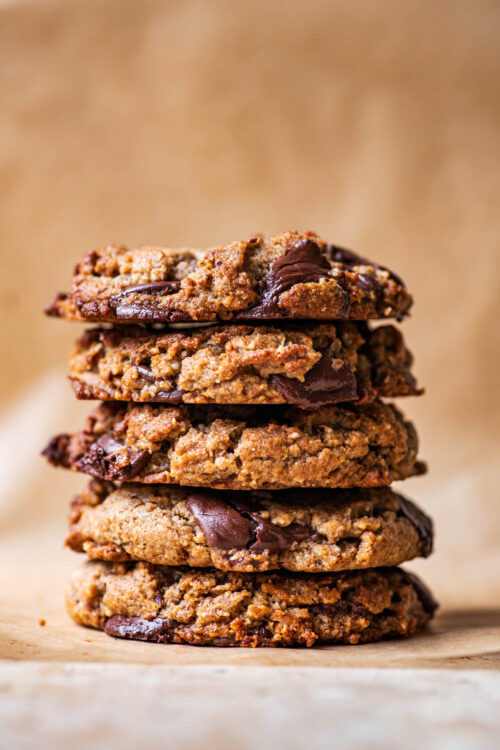 A stack of five large chocolate chip cookies.