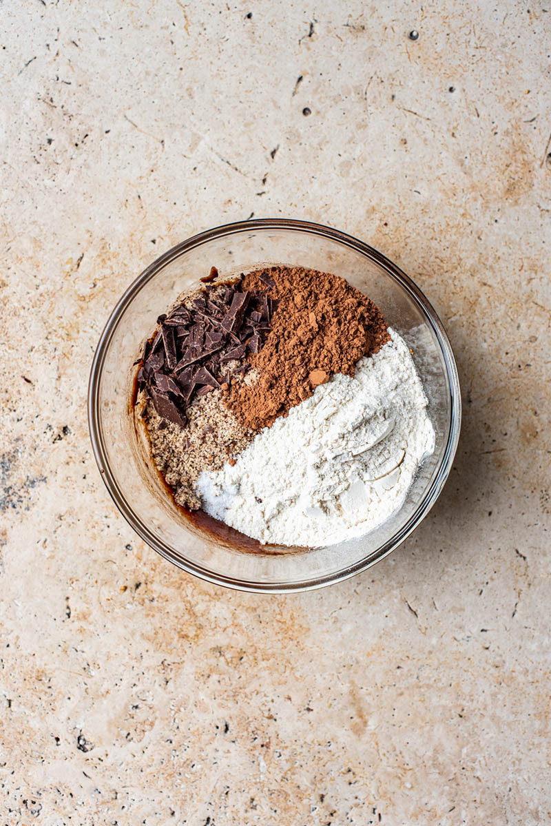 Dry ingredients added to the brownie batter bowl.