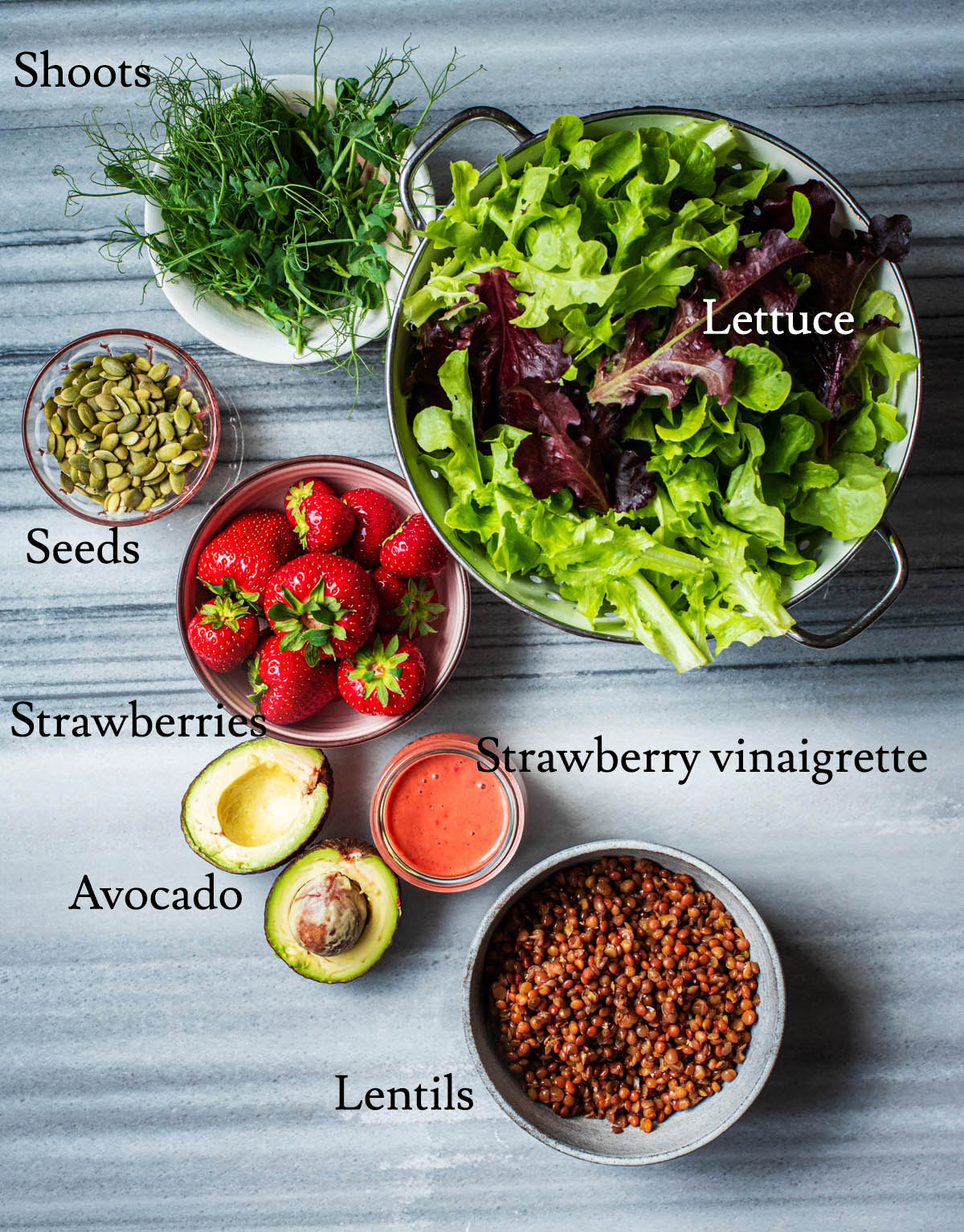 Strawberry salad ingredients with labels.