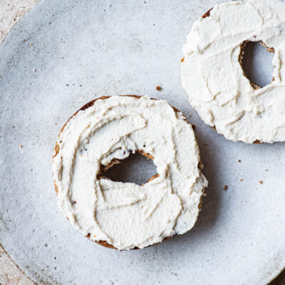 Cashew cream cheese spread onto toasted bagels.
