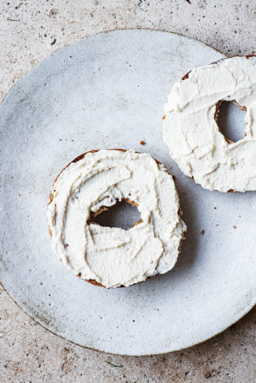 Cashew cream cheese spread onto toasted bagels.