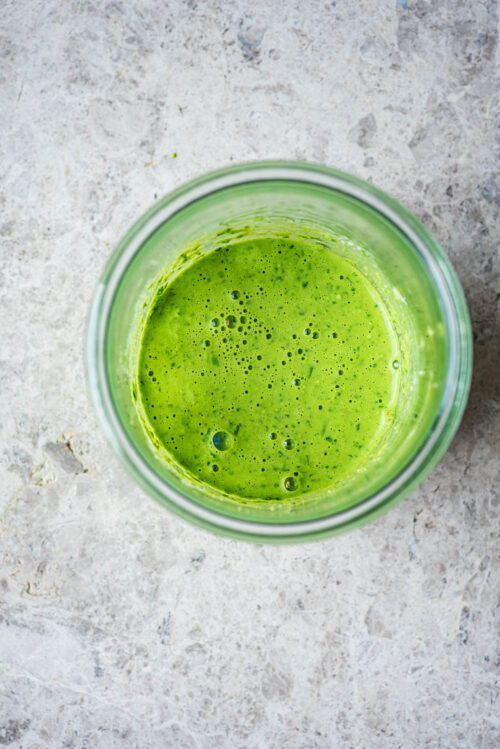 Pesto in the mixing jar, top down view.