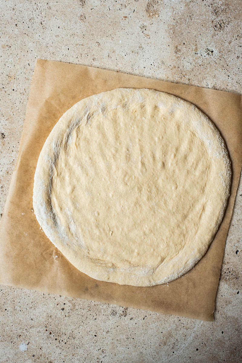 Dough after being shaped into a disc with higher edges.