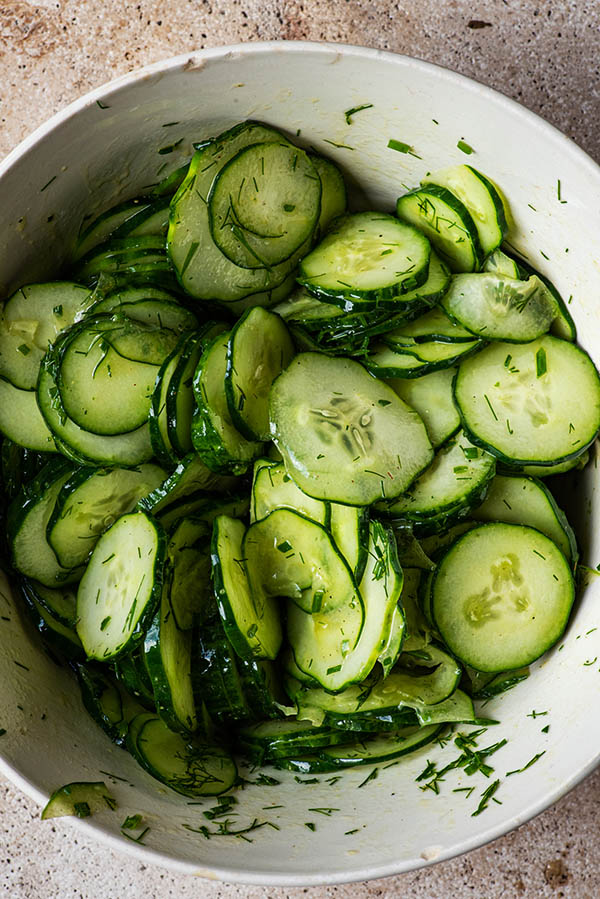 Cucumber salad after mixing in a large bowl.