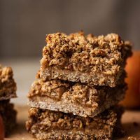 A stack of three bars with cinnamon sticks in foreground.