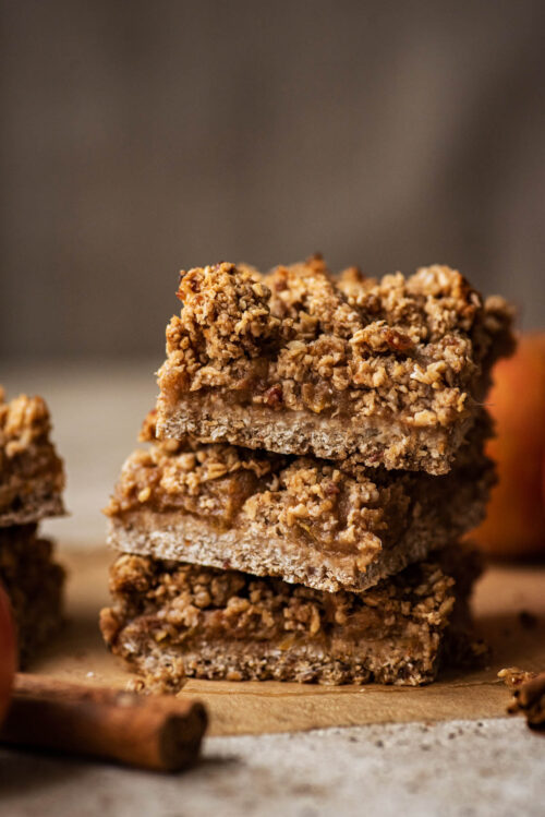 A stack of three bars with cinnamon sticks in foreground.