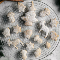 Finished cutout cookies on a wire rack.
