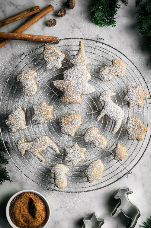 Finished cutout cookies on a wire rack.