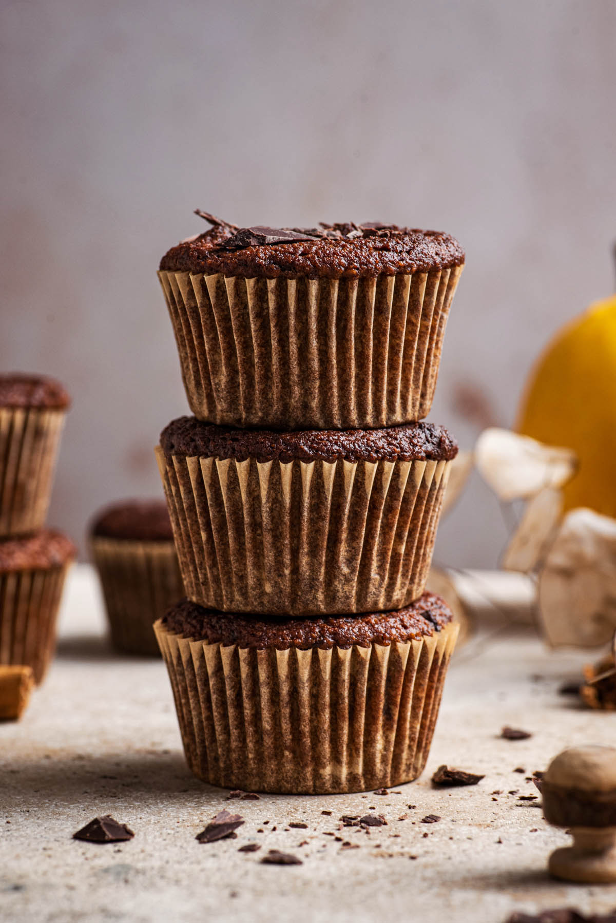 A stack of three muffins, close up.