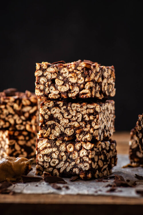 A stack of puffed wheat squares with more bars around.
