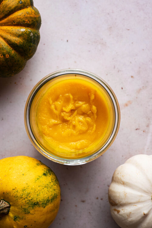 Top down view of pumpkin puree in a jar.