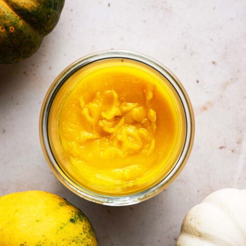 Top down view of pumpkin puree in a jar.