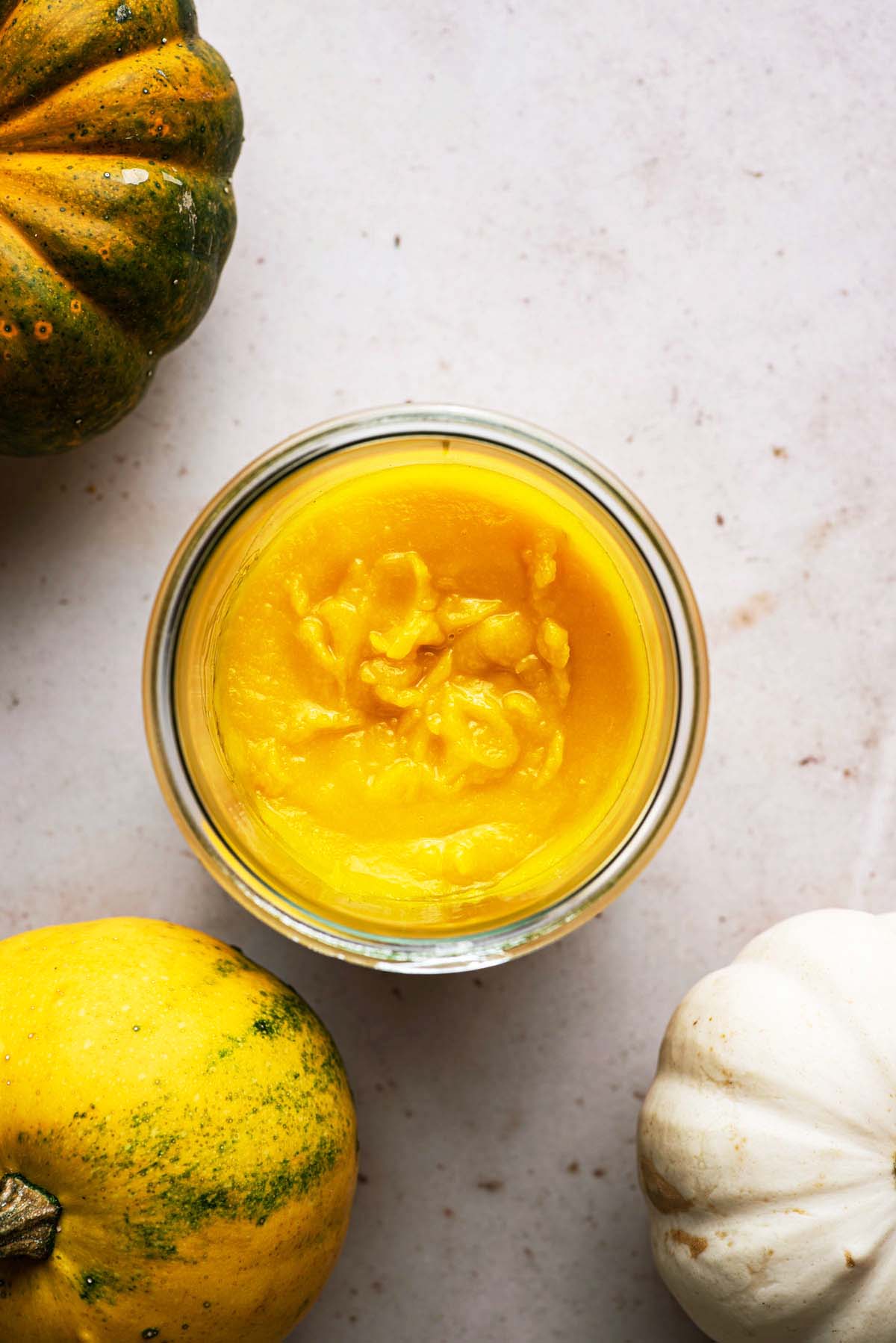 Top down view of pumpkin puree in a jar.