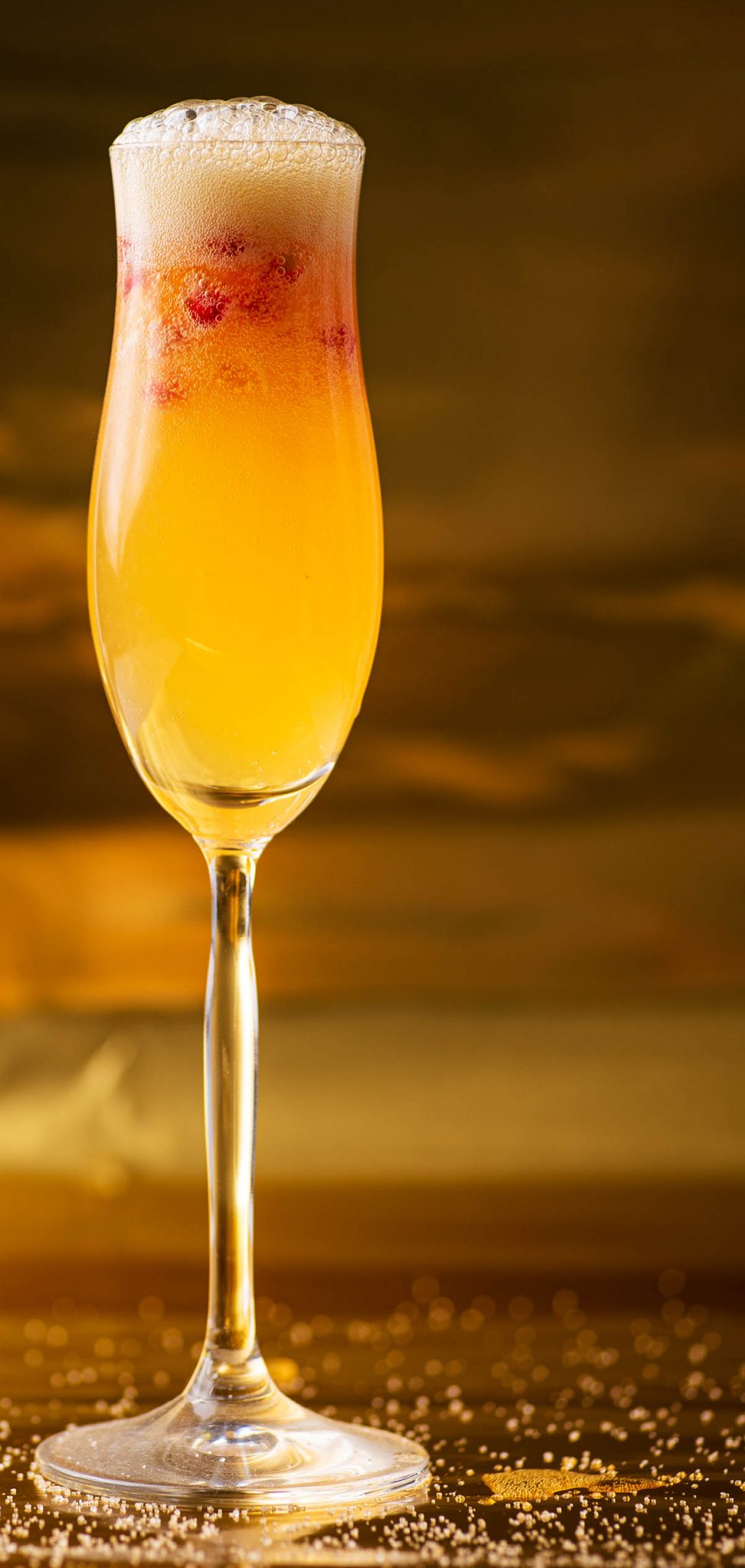 Close up of a tall champagne glass with a bubbly mocktail.