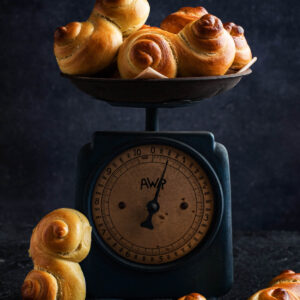 Saffron buns in an old kitchen scale.