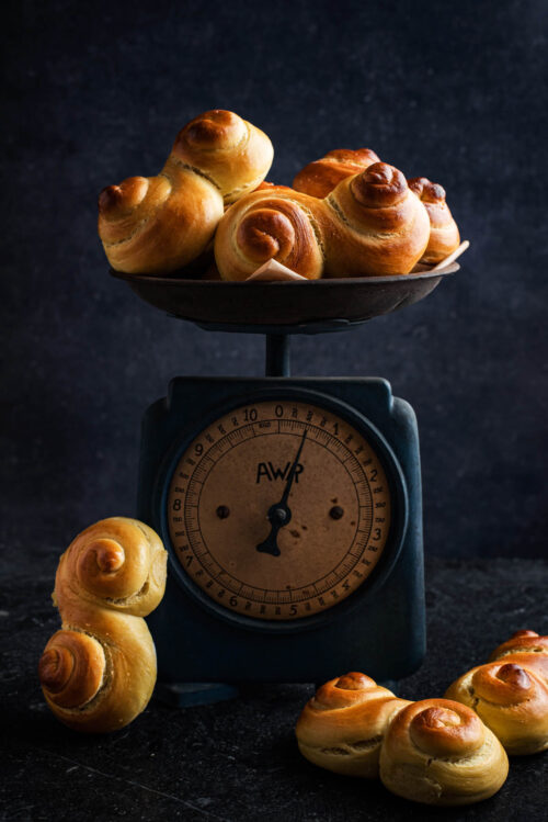 Saffron buns in an old kitchen scale.