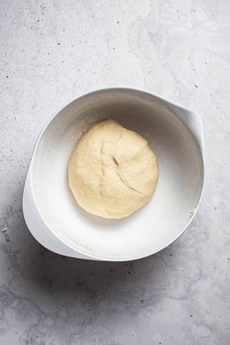 Kneaded dough in a mixing bowl.