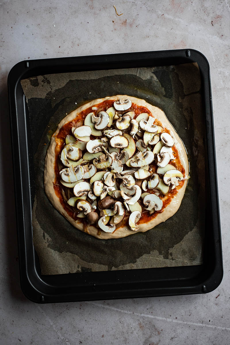 Vegetable topped pizza before baking.