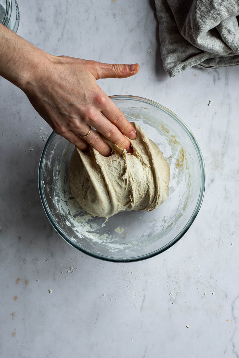 Folding the dough in a bowl.