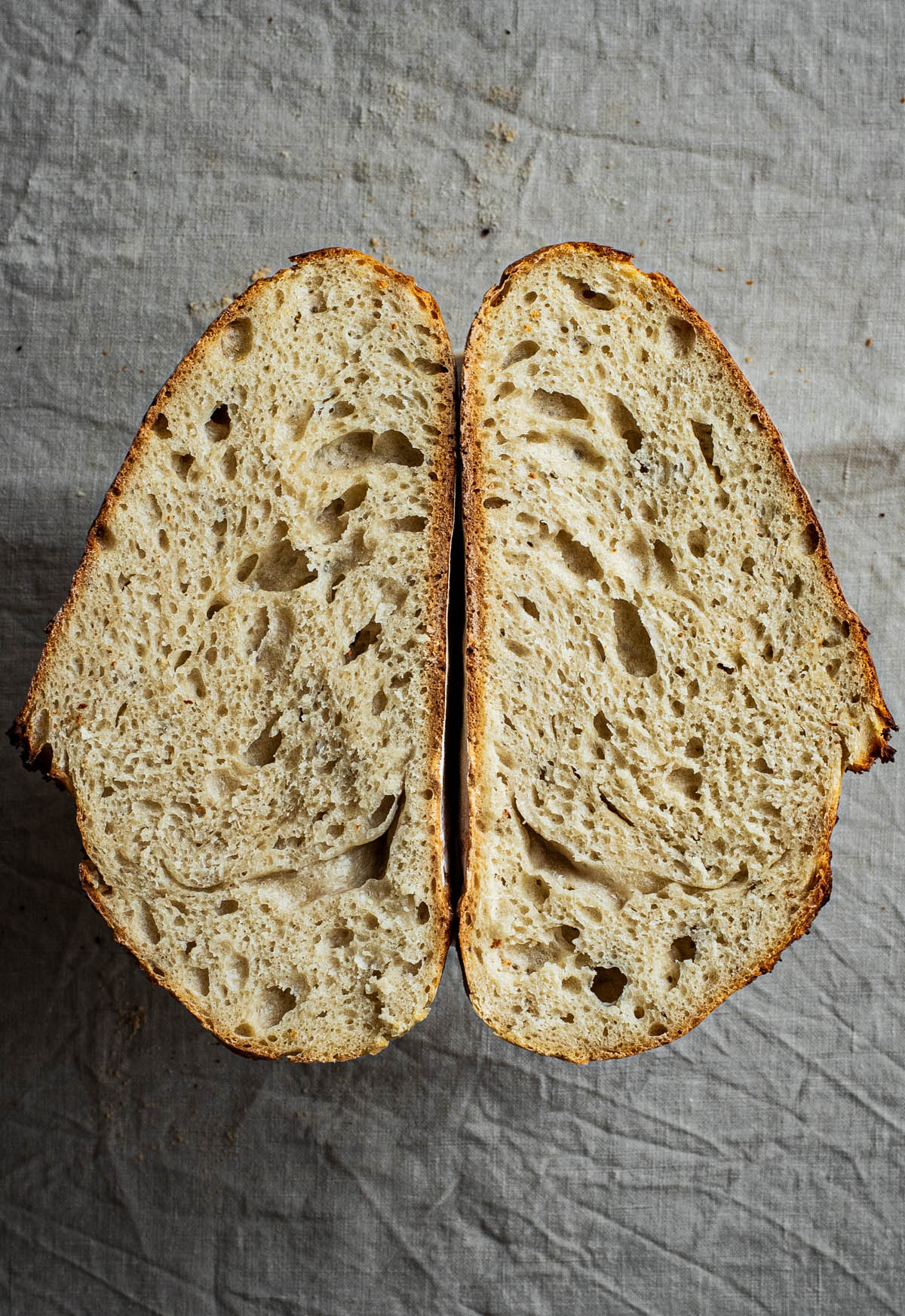 Halved bread loaf, interior facing up.