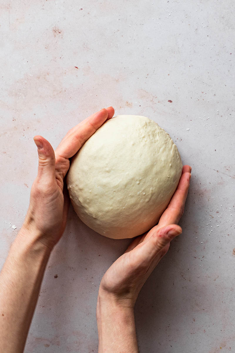 Shaping the dough into a boule.