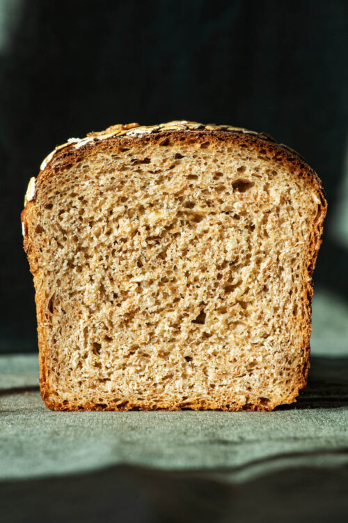 Loaf of bread sliced in half, front view, to show crumb.