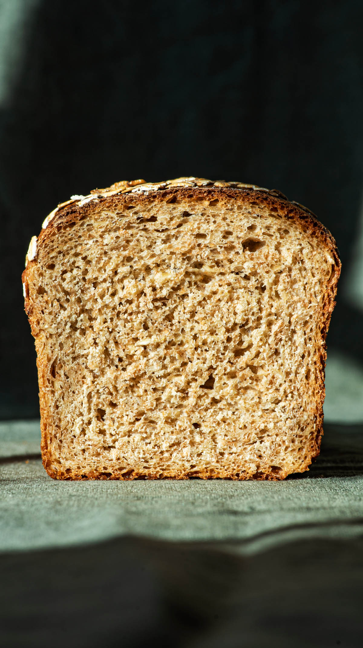 Loaf of bread sliced in half, front view, to show crumb.
